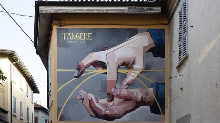 Street art, l'opera diffusa di Basik, 'La danza di San Michele', trasforma il centro storico di Paderno d'Adda