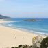 Rubano 40 chili di sabbia bianca dalla spiaggia di Chia, turisti francesi fermati all'imbarco a Porto Torres