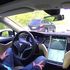 A bordo della Tesla a guida autonoma