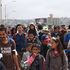 L'assalto al confine tra Tijuana e San Diego